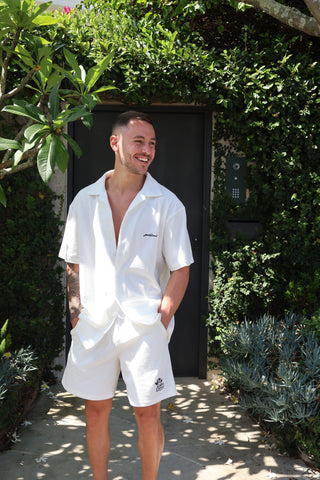 white terry towel shorts. Elevated comfort, stylish going out or lounge shorts for men. Navy embroidery logo