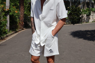 white terry towel shorts. Elevated comfort, stylish going out or lounge shorts for men. Navy embroidery logo